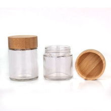 eco friendly 3oz clear glass packaging bottles with bamboo wooden lids for storage
